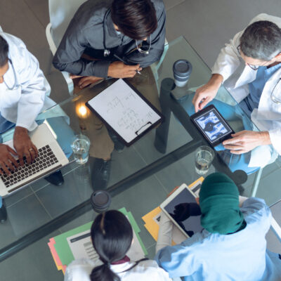 Medical team working together at table in hospital