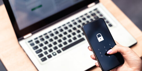 Phone password lock for mobile cyber security or login verification passcode in online bank app. Data privacy and protection from hacker, identity thief or cybersecurity threat. Laptop and smartphone.