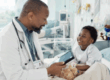 Pediatrician with child in hospital