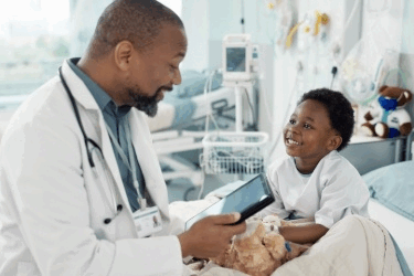 Pediatrician with child in hospital
