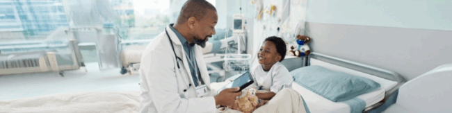 Pediatrician with child in hospital